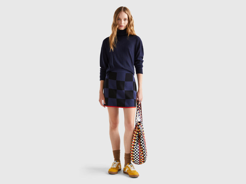 https://nl.benetton.com/knit-checkered-mini-skirt-dark-blue-1094E000G_252.html