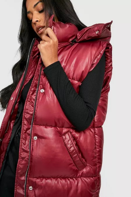 https://nl.boohoo.com/tall-gewatteerde-glanzende-bodywarmer-met-capuchon/GZZ22755.html?color=294