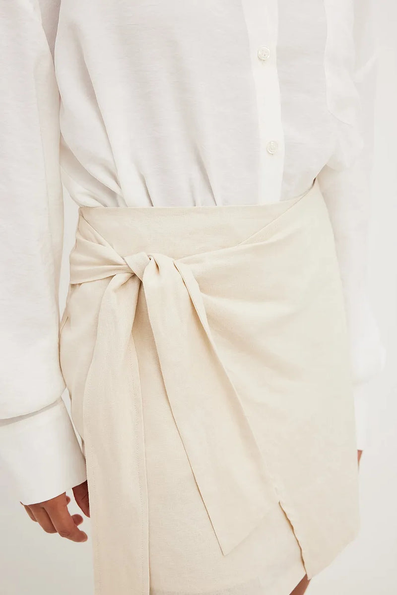 https://www.na-kd.com/nl/zoek-producten/linen-bland-wrap-skirt-beige-1100-006218-0005