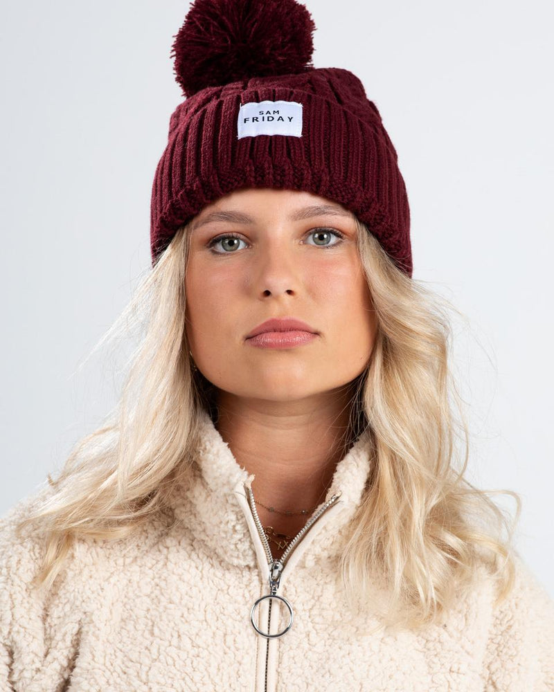 Dames wintermuts logo print beige zwart rood